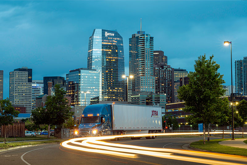 XTRA Lease trailer on busy city street